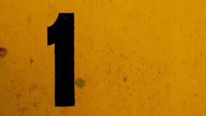 Black number 1 on yellow background. Photo: Sarah Murray via Creative Commons.