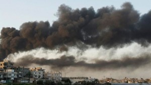 Smoke from buildings damaged in Gaza Strip, 2008. Photo: Amir Farshad Ebrahimi via Creative Commons.
