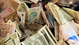 Mulit-currencies notes and coins. Photo: epsoS.de via Creative Commons.