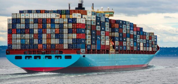 Photo of a cargo ship carrying freight containers for international trade