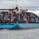 Photo of a cargo ship carrying freight containers for international trade