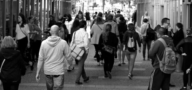 Grayscale Photography of People Walking Near Buildings
