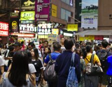 Photo of a crowd of people walking in Hong Kong