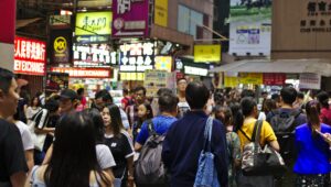 Photo of a crowd of people walking in Hong Kong