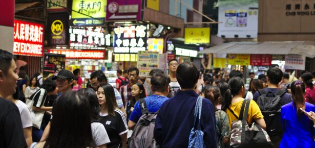 Photo of a crowd of people walking in Hong Kong