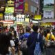 Photo of a crowd of people walking in Hong Kong